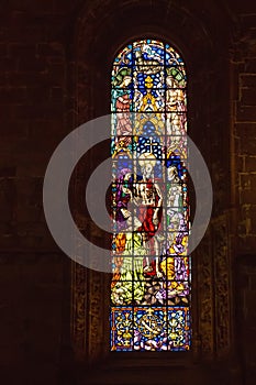 Colored stained glass in the windows of the Hieronymites monastery in Lisbon, Portugal