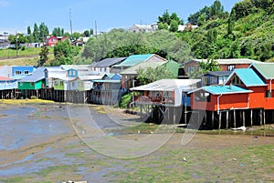 Colored stilt houses Castro during low tide, Chiloe Island, Chile