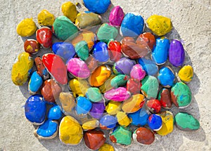 Colored stones lying on a flat surface
