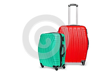 Colored suitcases on white background. Close up