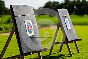 Colored target board with arrows archery target background