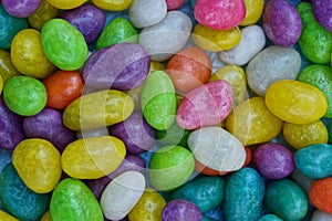 Colored texture of a pile of small chocolates