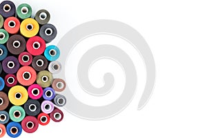 Colored thread coils on a white background, sewing supplies, text ready, banner, book or magazine cover