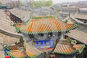 A colored tiled roof of a city gate in Pingyao