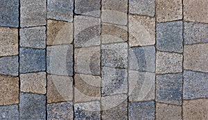 colored trapezoid concrete tiles pavement in high angle view - full frame background and texture