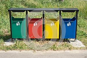 Colored trash containers in a park