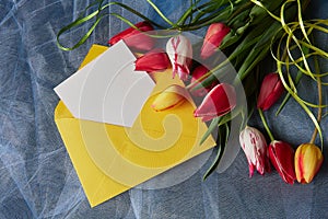 Colored tulips and  envelopeon abstract background