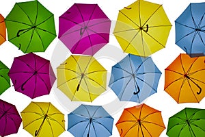 Colored umbrellas in the air.