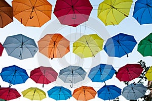 Colored umbrellas floating