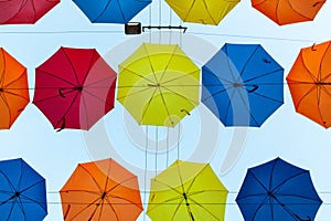 Colored umbrellas floating