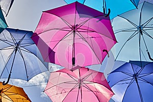 Colored umbrellas hanging