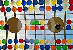 Colored umbrellas on a transparent ceiling