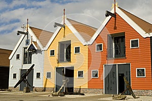 Colored warehouses in harbor photo