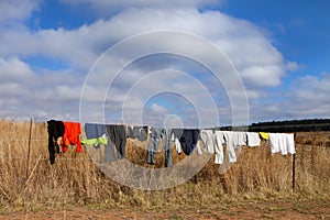 Colored washing on wire fence in africa