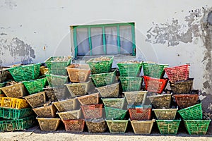 Colored waste plastic tray filled with oyster shells