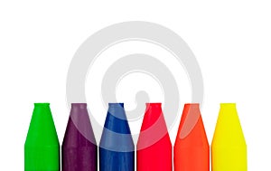 Colored wax crayons of 6 colors isolated on a white background