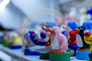 Colored whistles made in porcellana from the city of Alberobello, south of Italy on Blurred Background