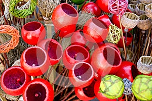 Colored wickerwork and colored poppy pods
