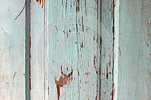 Colored wood background with peeling old paint