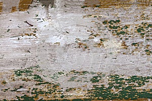 Colored wood background with peeling old paint