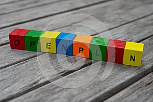 Colored wooden cubes with letters. the word openplan is displayed, abstract illustration photo