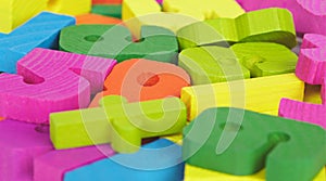 Colored wooden letters and numbers