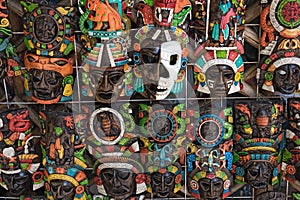 Colored wooden masks at a souvenir stand in Chichen Itza, Yucatan, Mexico