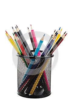 Colored wooden pencils in black metal glass on white background side view