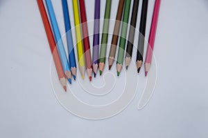 Colored wooden pencils on a white background. text space. banner