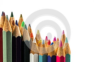 Colored wooden sharpened pencils for office and school on a white background photo