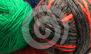 Colored wool knit balls placed on a