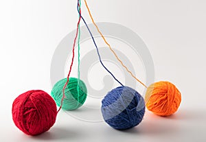 Colored wool knit balls placed on a