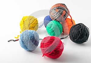 Colored wool knit balls placed on a