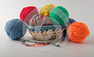 Colored wool knit balls placed on a