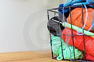 Colored Yarn in metal basket with crochet hook