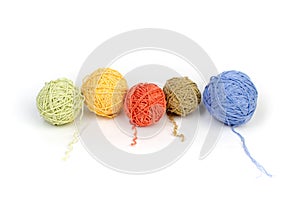 Colored yarn on a white background. Skeins of wool yarn for knitting. Balls of wool of different colours for handmade knitting on