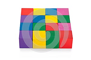 Colorful 4*4 square of wooden toy cubes isolated on white