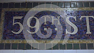 Colorful 59th Street station subway tile mosaic with white green yellow blue purple and pink tiles