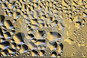 Colorful abstract background. Beautiful macro shot of water drops on a window