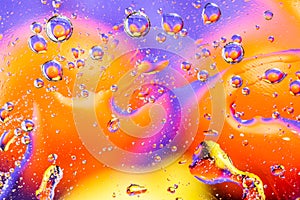 Colorful abstract background. Water drops rainbow colors on glass. Amazing abstract water drops on glass texture or background. Se