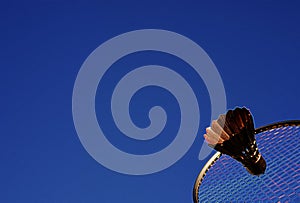 Colorful abstract badminton racket and shuttlecock sky blue.