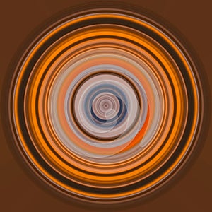 Colorful abstract bright circle , circular lines , radial striped texture in orange tones on brown background. Round pattern