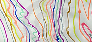 Colorful abstract scribble by felt-tip pen, handwritten lines by marker, random sketches as abstract background on white