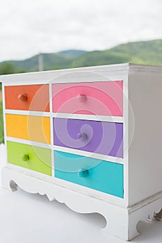 Colorful of accessories cabinet with drawer