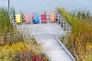 Colorful Adirondack chairs in Muskoka resort