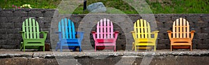 Colorful adirondack chairs on a Wisconsin lake deck