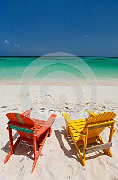 Colorful adirondack lounge chairs at Caribbean beach