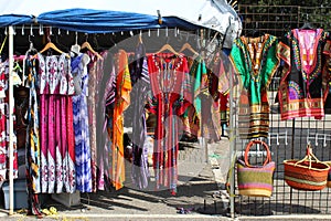Colorful African fashions at an outdoor flea market