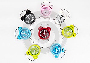 The colorful alarm clocks put on white background