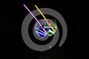 Colorful alcoholic beverages with dark background for party, new year, bar and christmas with straw
